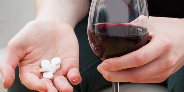 wine_pills_hand